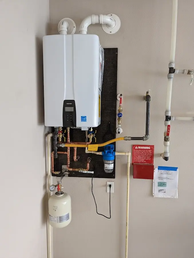 Professional plumber installing copper piping in a Kingfisher home